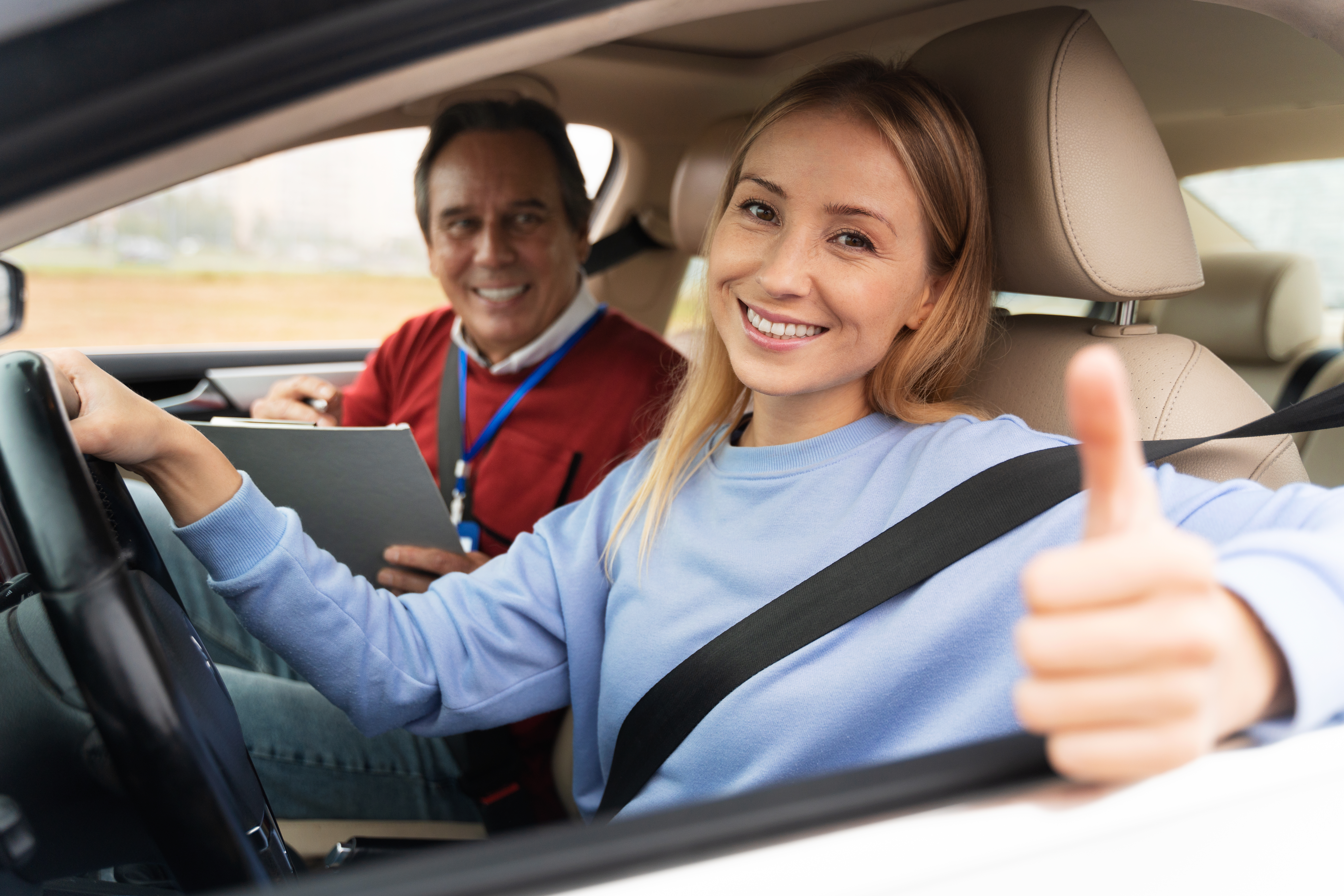 woman male driving instructor driving test